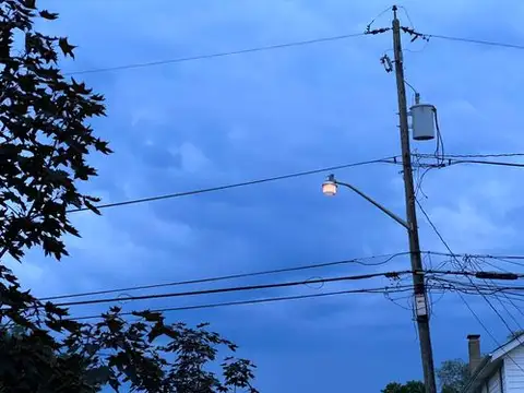 Streetlight dreams under a twilight sky.